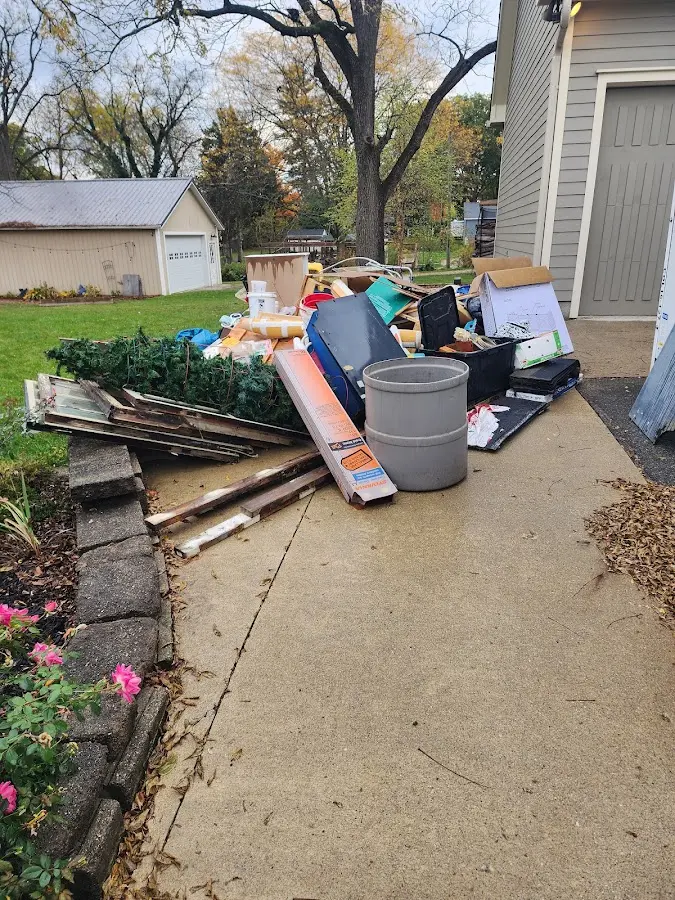 Dumpster being loaded with debris for 30 Yard Dumpster Rental in Crockett